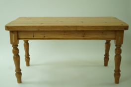 A pine kitchen table with a deep top and turned legs, 80.5cm high, 86cm long, 153.