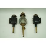 A pair of Victorian painted coaching lamps, 44cm long, along with a brass example,