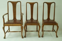 A set of six early 20th century oak dining chairs with drop in seats,