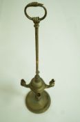 A brass four branch table lamp with ring handle in the form of a swan,