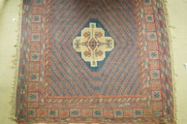 A Belouch rug with pile central medallion on a flat woven repeating field within three borders,