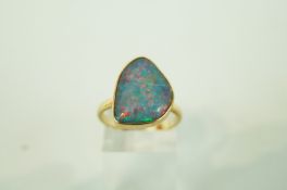 An opal triplet 9 carat gold ring, finger size P,