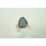 An opal triplet 9 carat gold ring, finger size P,