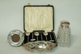 A set of six coffee spoons with coffee bean finials, in case; a silver pierced bon bon dish,