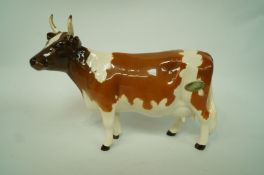 A model of a Beswick Ayrshire cow, printed marks in black "Chickham Bessier 198",