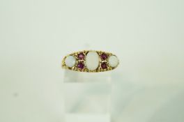 A three stone opal 9 carat gold ring,