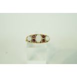 A three stone opal 9 carat gold ring,