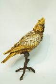 A Geshutz cold painted bronze model of a parrot standing on a branch, impressed marks,