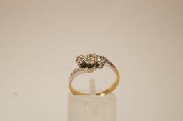 A three stone diamond ring, stamped '18ct Plat Set',