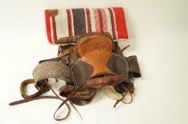 A Western saddle and a Navajo blanket