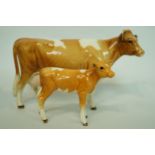 A Beswick cow and calf,