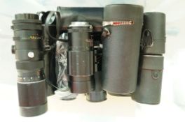 A large quantity of cased and uncased camera lenses including a Sigma zoom lens,