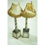 A pair of 20th century painted wooden lamp stands,