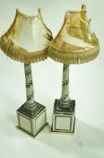 A pair of 20th century painted wooden lamp stands,