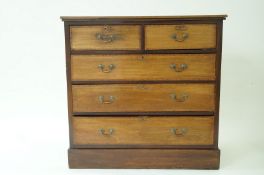 An Edwardian mahogany chest of two short and three long drawers with plinth base, 101cm high,