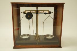 A pair of weighing scales in a mahogany case, by Griffin and Tatlock Ltd.