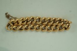 A bracelet stamped '15', of hollow curb links to a hidden box clasp, with a safety chain,