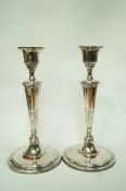 A pair of silver plated candlesticks,