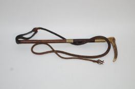 A Gentleman's hunting crop, with horn handle, above plated mounts and leather thong,