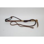 A Gentleman's hunting crop, with horn handle, above plated mounts and leather thong,