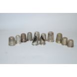 A small collection of thirteen thimbles,