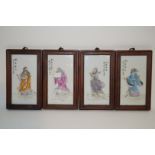 A set of four Chinese porcelain plaques, each painted with an immortal and with Chinese characters,