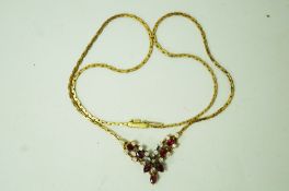 A ruby and diamond 18 carat gold necklace,