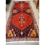 A Hamadan rug, with central medallion on a blue and red ground ,