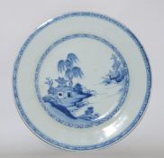 An 18th century Chinese porcelain plate, painted in blue with a landscape, Ex Nan King Cargo, 22.