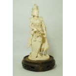 A late 19th century carved ivory Burmese figure of a lady, in traditional costume,