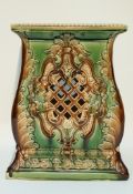 A late 19th century green glazed jardiniere stand, with pierced decoration,