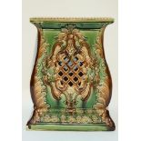 A late 19th century green glazed jardiniere stand, with pierced decoration,