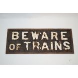 A late 19th century cast iron "Beware of trains" sign, 24.