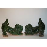 A pair of Chinese earthenware dogs of Fo, both with translucent green glaze, 50cm high,