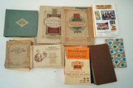 A collection of cigarette cards and trade catalogues to include some complete sets