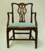 A 19th century George III style chair with serpentine front and square legs