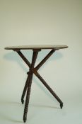 A unusual oak occasional table, with oval two plank top,