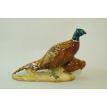 A Beswick model of two pheasants, moulded marks, 2078,