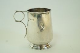 A silver mug, inscribed, 8cm high, 66g (2.