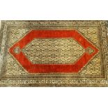 An Eastern silk rug,