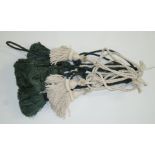 Four green silk tassel tie backs and four cream tassel tie backs