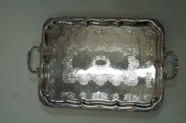 A silver plated two handled tray, of rectangular outline, with foliate decoration, 66.