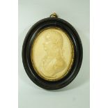 An oval composite plaque moulded in relief with a bust of Admiral Lord Nelson,