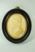 An oval composite plaque moulded in relief with a bust of Admiral Lord Nelson,