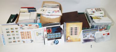 A large collection of stamps, including two albums of Great Britain packs, covers and maximum cards,