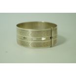 A Charles Horner silver engine turned buckle bangle, Chester 1941, 2.