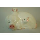 A Beswick Model "Hide And Seek" in the form of a pig and two piglets,