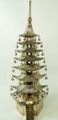 A Chinese silver table ornament in the form of a pagoda, indistinct stamped marks to the base,