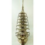 A Chinese silver table ornament in the form of a pagoda, indistinct stamped marks to the base,