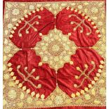 A mid 20th century Indian velvet table cloth with central gold and silver embroidered medallion,